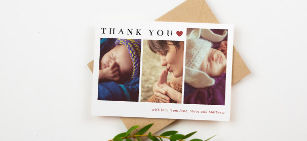 A christening thank you card with photos. The christening thank you card is printed with 3 portrait baby photos and cute red heart design.