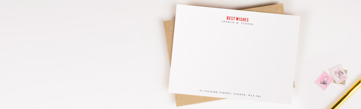 A personalised correspondence card, printed on white card with “Best Wishes” printed at the top in red. The card has a name and address in a black.