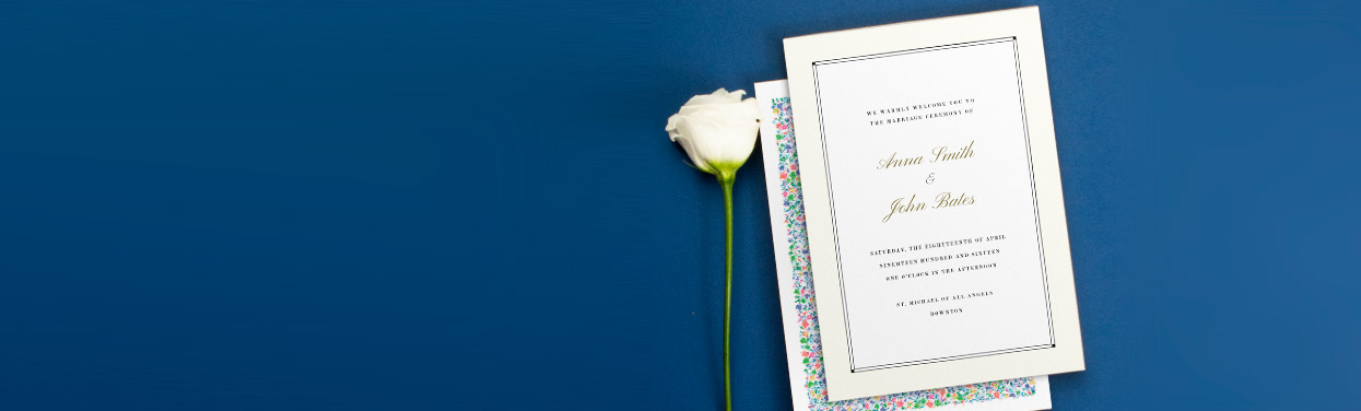 Two wedding order of service designs. A traditional, cream booklet sits on top of a floral wedding order of service design.