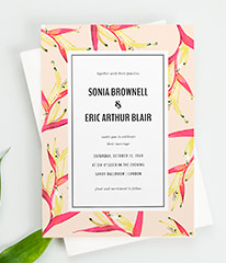 A floral wedding invitation card design. It is a modern floral wedding invitation with a pink bird of paradise border and striking typography.