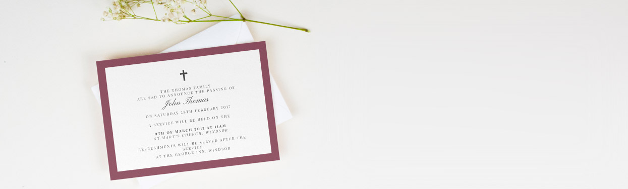 A classic and elegant funeral announcement card. The invite is printed with a black crucifix and a thick maroon border.