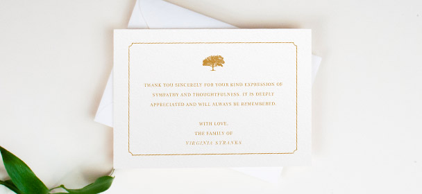 Personalised funeral thank you cards with gold border and oak tree motif on white envelopes