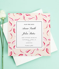 A modern wedding save the date card design with beautiful falling petals. The card is pink and peach with a white centre. 