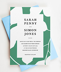 A personalised modern wedding invitation design. The wedding invite has a green and white floral motif and modern, black typography.