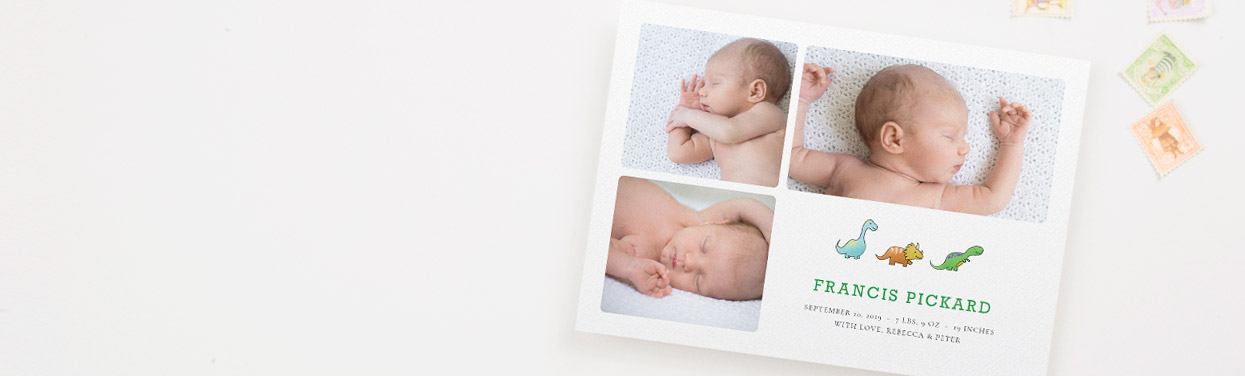 A printed, personalised baby birth announcement card. The stationery card has 3 photos of a new-born baby, and a cute dinosaur design.