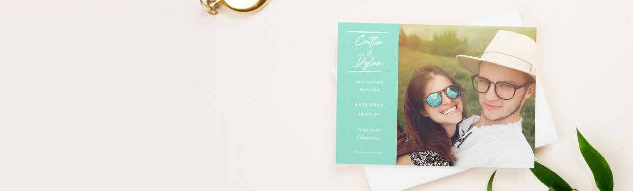 A personalised wedding save the date card with a photo. The save the date design is printed with a large photo of a couple.