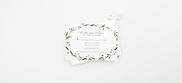 A matching wedding RSVP card with a cute floral design. The response card is printed with spaces where wedding guests can write their attendance.