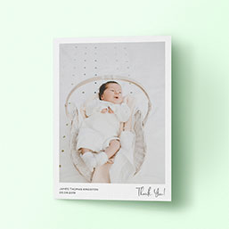 Simple A5 portrait baby thank you card with large smiling baby photo