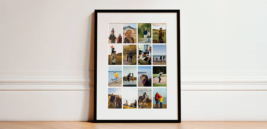 Framed and mounted photo collage with black frame leaning against white wall