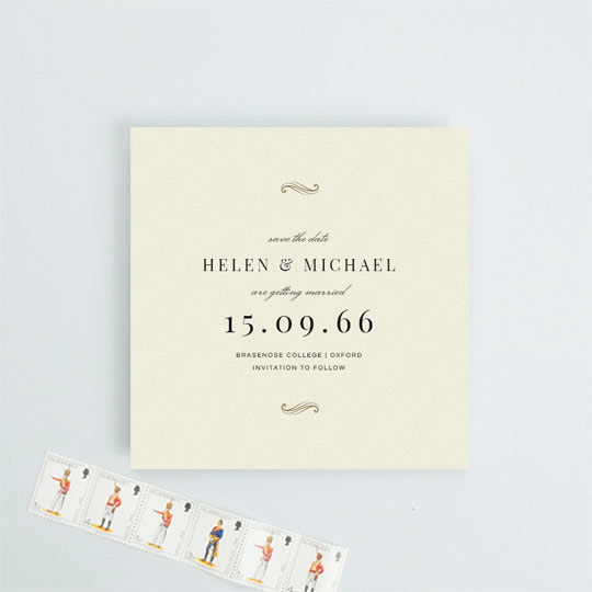 A vintage, square wedding save the date card. The card has a cream background with gold flourished at the top and bottom. This save the date has an art deco feel to it.