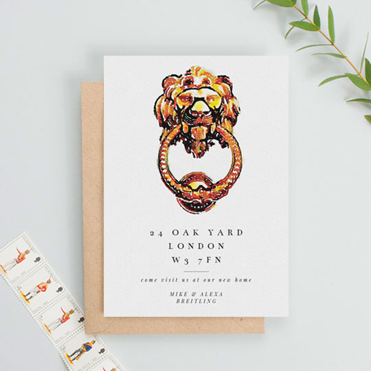 A moving home card in portrait orientation. It has a large, painted bras door knocker in the shape of a lion. Underneath is a new address and a personalised message of thanks