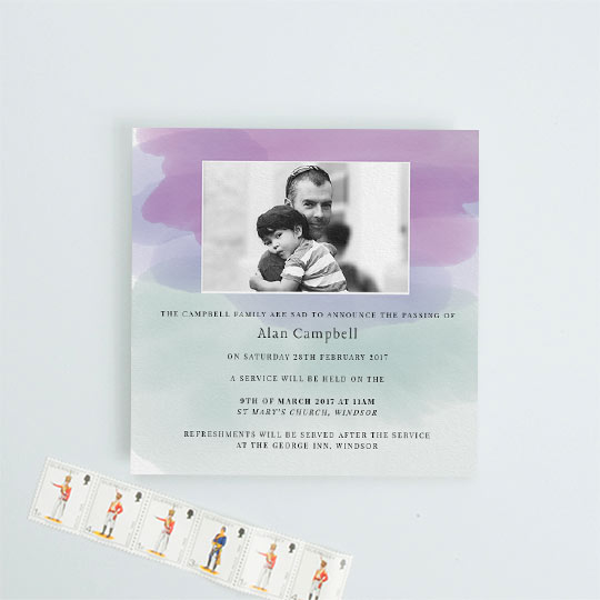 Modern funeral announcement card with watercolour-effect swathes of colour, mainly purple, green and blue. It has a photo in black and white of the deceased and details of a funeral service below.