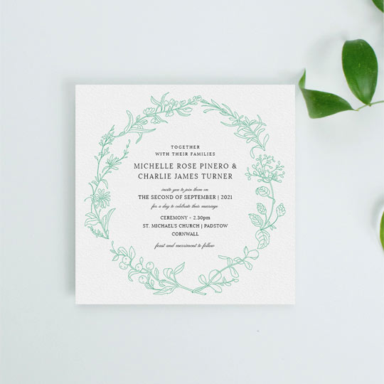 This wedding invitation design had the hand drawn outline of green botanical plants. The border is minimalist and modern, with classic wedding invitation text in the centre of the card.