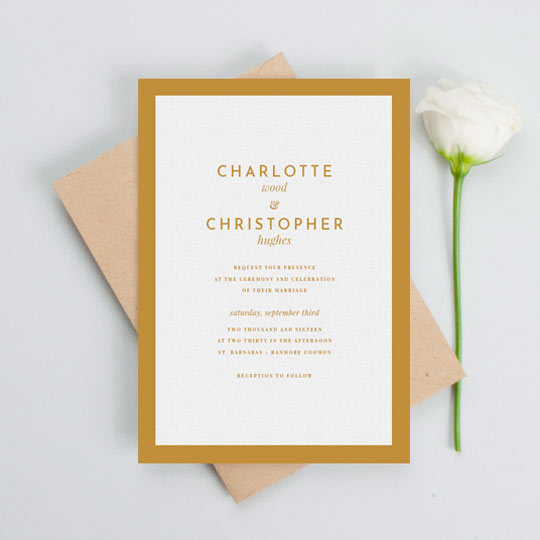 A beautiful wedding invitation with a bold orange border. The wedding invitation has a very simple and elegant invitation text in an orange font on a white background.
