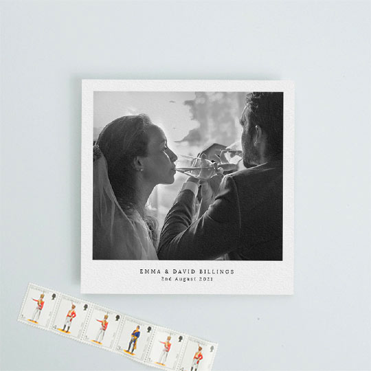 A simple and classic wedding thank you card with a large black and white photo on a white background. The thank you card has the name of the bride and groom and the date of their wedding.