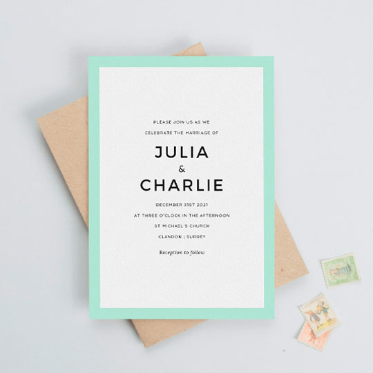 A modern and simple wedding invitation card design with a bold, mint blue border. The wedding invitation has a lot of white space around some centralised wedding invite text in a bold, sans-serif font.