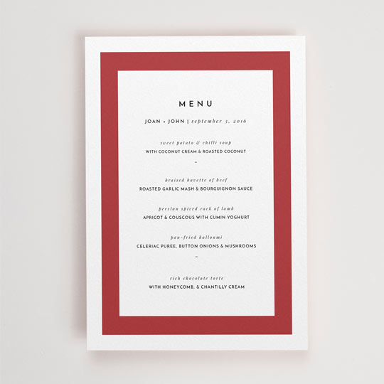 An A5, white wedding menu with a thick, bold, red border. “Menu” is printed at the top of the menu card and the courses of food follow underneath.