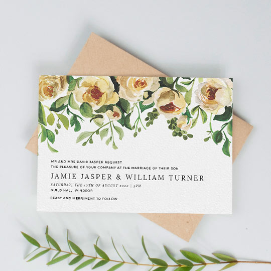 A vintage, landscape wedding invitation design. The top half of the card is filled with a beautifully painted rose bush. Underneath, black wedding invitation text sits to the left of the card.