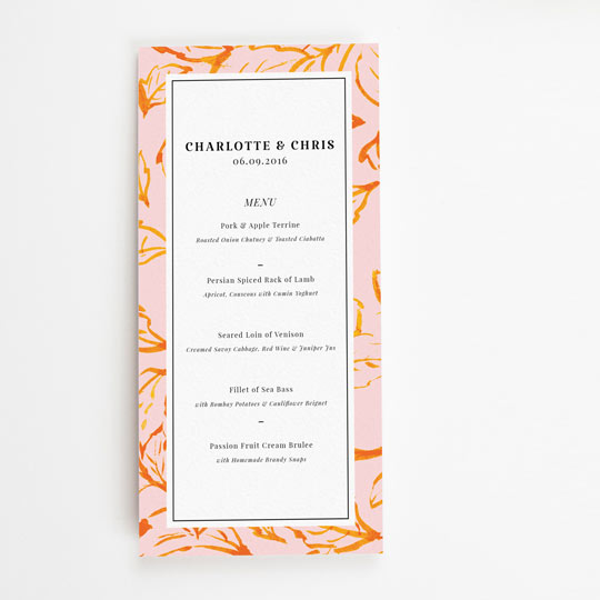A tall, thin wedding menu with a modern, autumnal pink and orange leaf design. The centre of the wedding meal menu is printed with a black meal plan in multiple course.