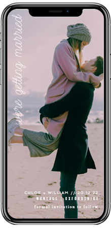 Full page wedding save the date card on a smartphone screen. It is of an engaged couple hugging.