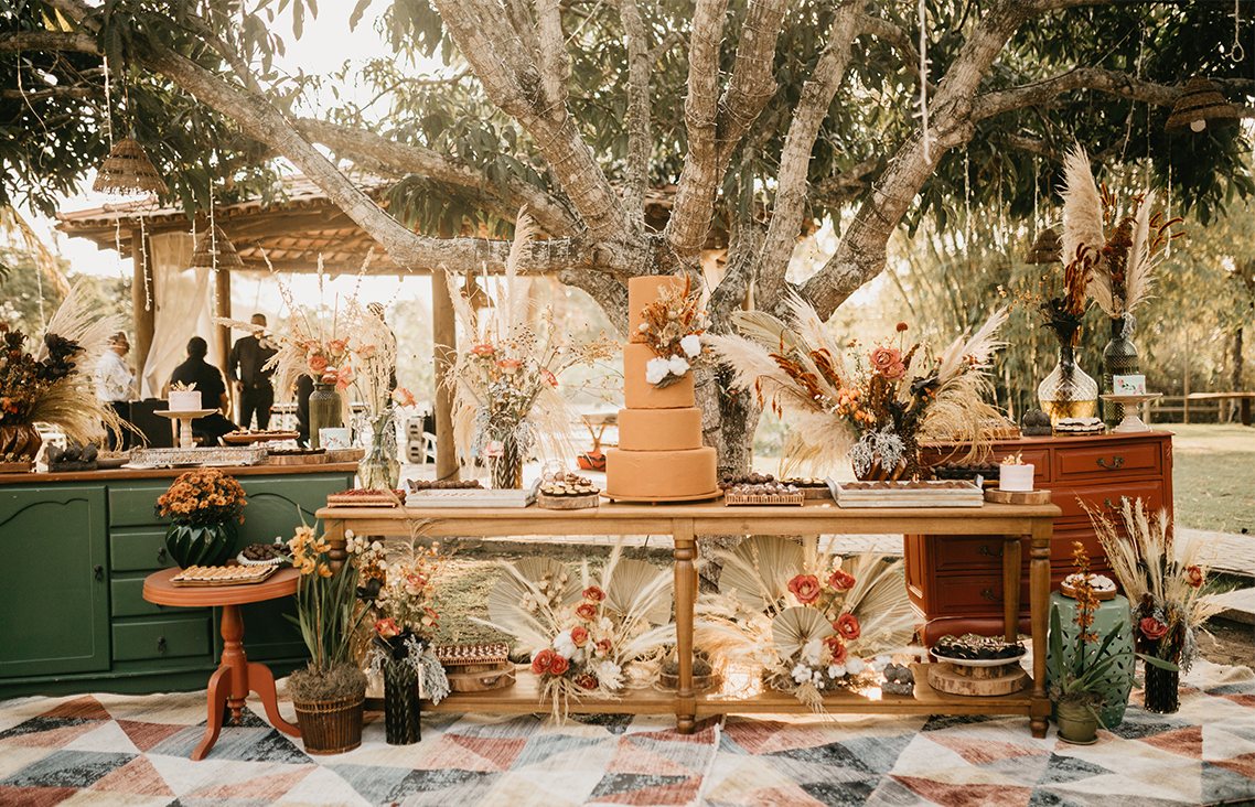 Photo of a botanical-looking wedding setup outside. Photo of a botanical-looking wedding setup outside.