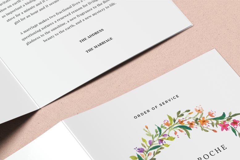 A close-up photo of an 8-pages wedding order of service design. Floral motif.