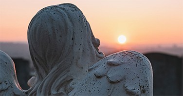 A stone angel in a graveyard