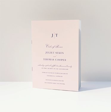 A traditional wedding order of service with a pink cover, and a monogram detail. A traditional wedding order of service with a pink cover, and a monogram detail.