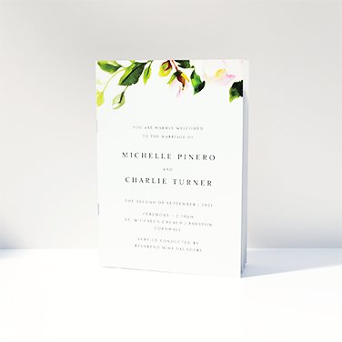 A watercolour design wedding order of service booklet. Pink rose and green leaf motif.