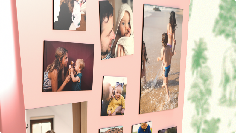 Collection of photo fridge magnets with family photos on a pink fridge door.