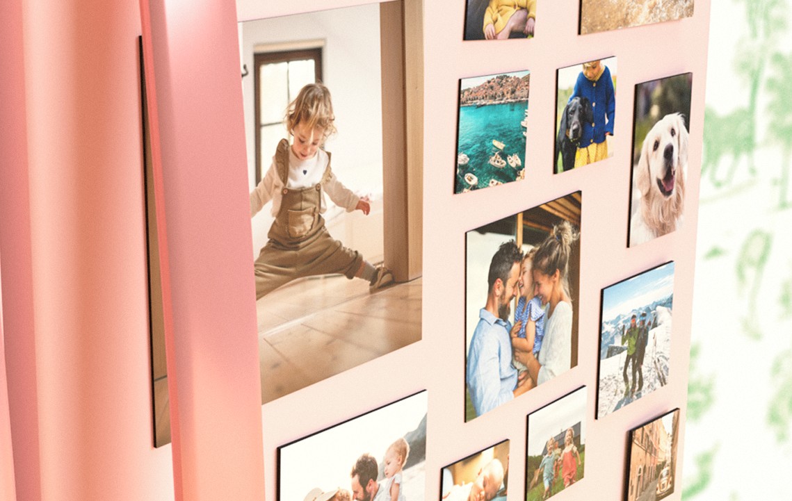 Photo fridge magnets of multiple sizes are stuck to the front of a pink fridge’s door. There are family, holiday and pet photos.