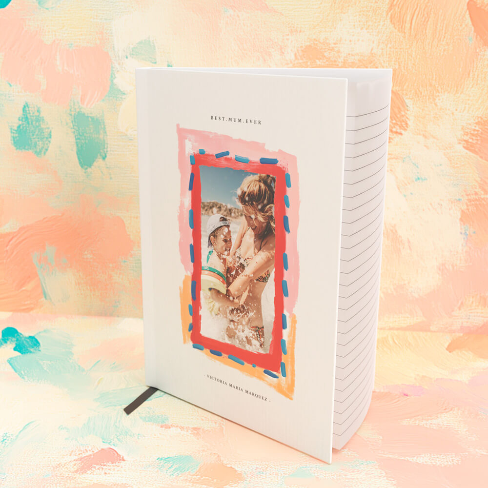 Personalised notebook with a photo of a mother and baby on the beach, framed by colourful brushstroke artwork and the title 