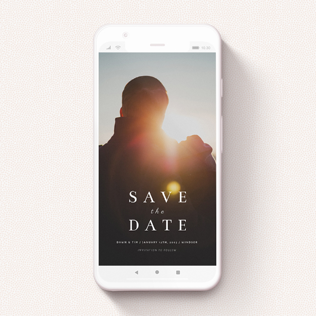 An online wedding save-the-date with a photo and the words 'Save the Date' written in a classic font.