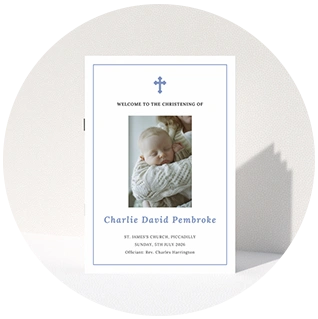 Photo christening order of service with blue cross and sleeping baby