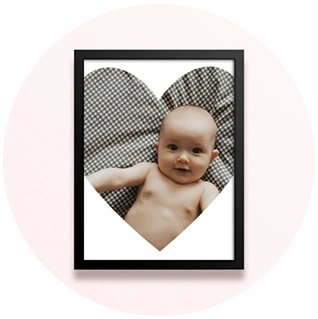 Simple framed nursery photo print with heart-shaped baby photo