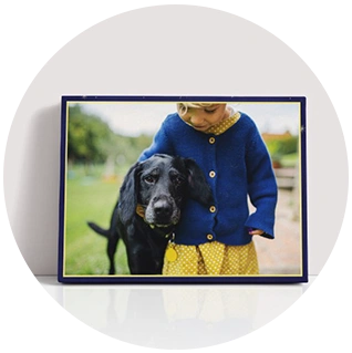 Landscape canvas print with child and black dog photo in navy border